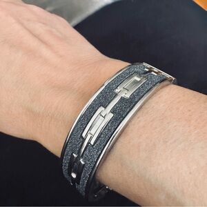 Silver and Black Metal Bangle Bracelet with Chain Design